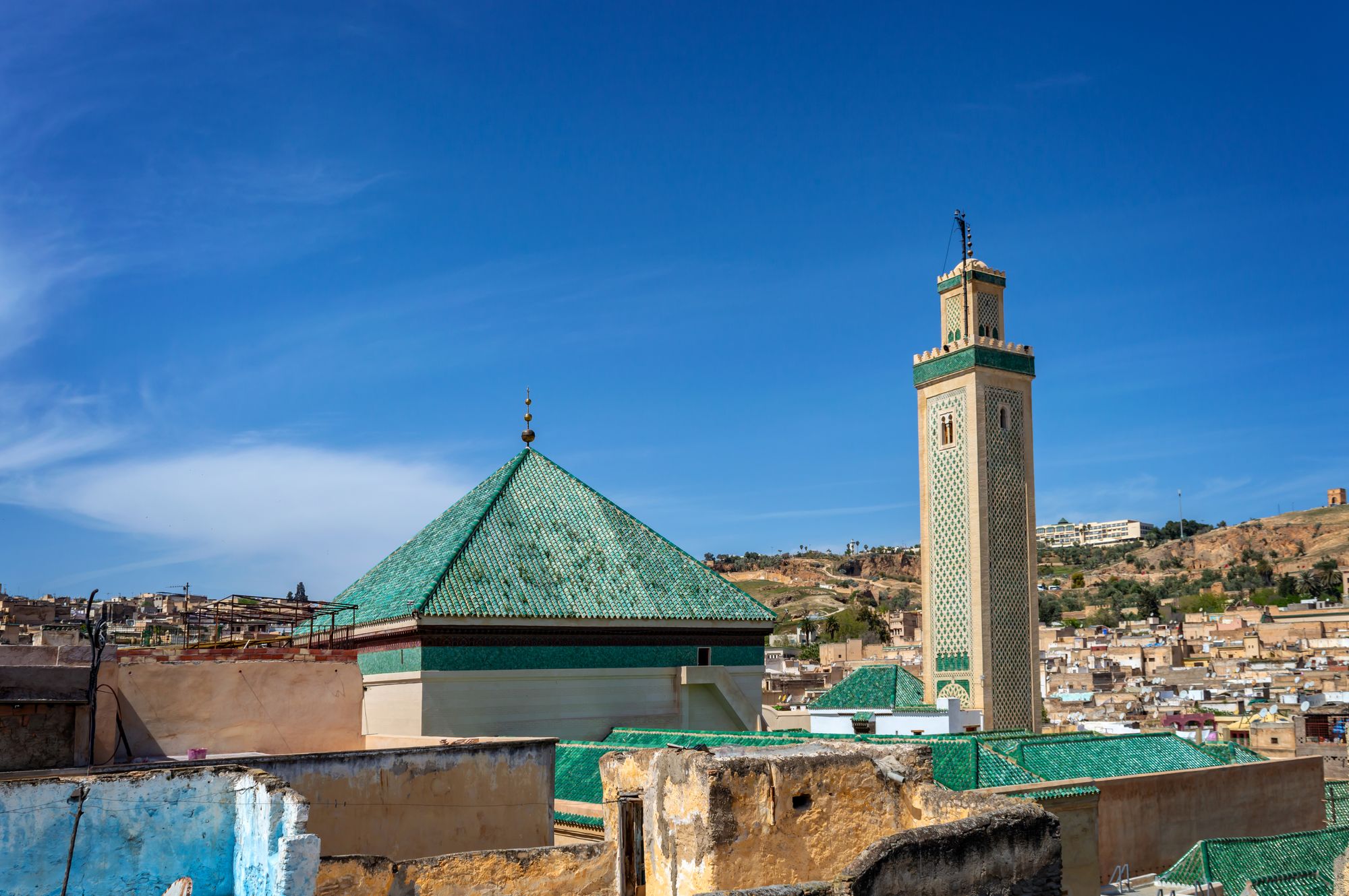 Aerial view of the green roof and minaret of al-Qarawiyyin Mosque in Fes