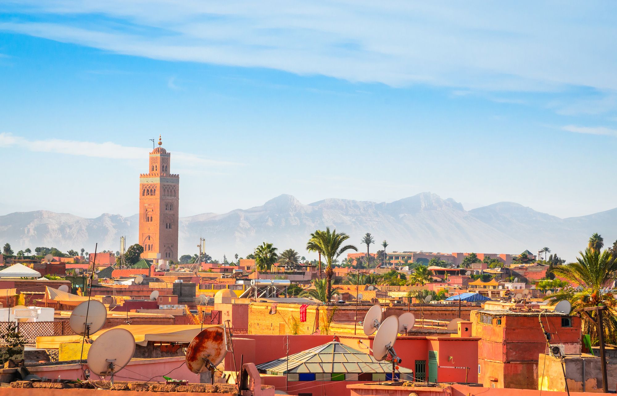 Marrakech, with a view of the Atlas Mountains and the minaret of the Koutoubia Mosque